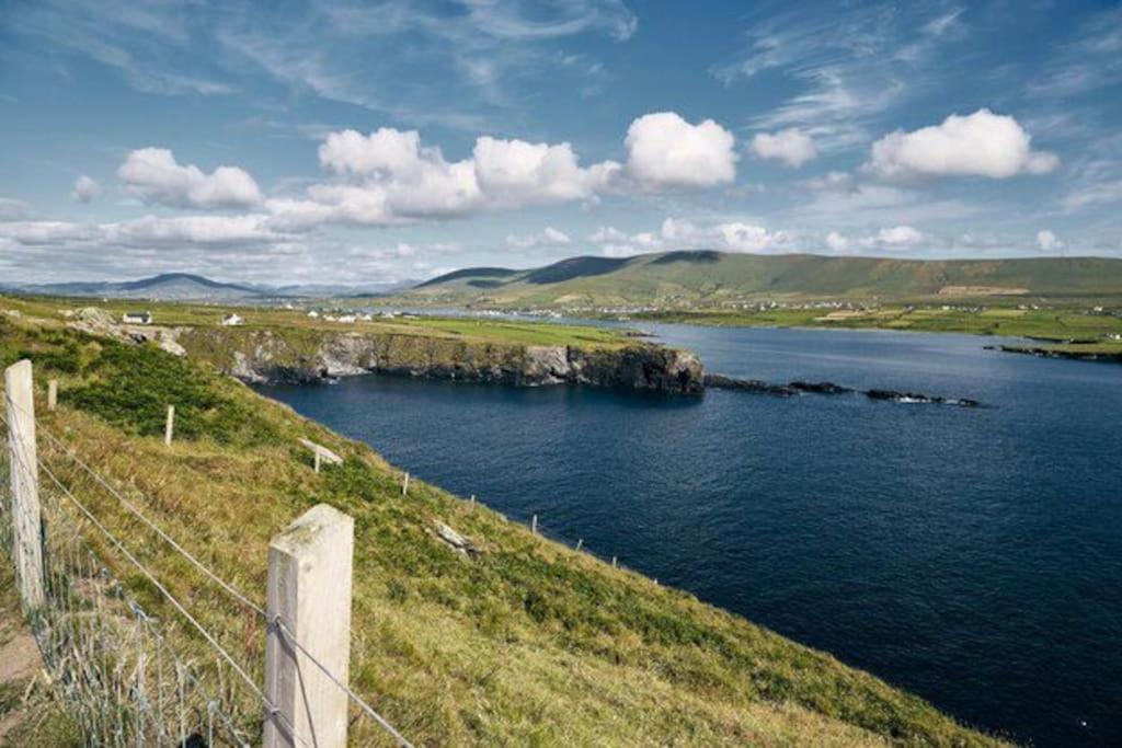 a view of a body of water with a fence at Harbor View in Valentia Island