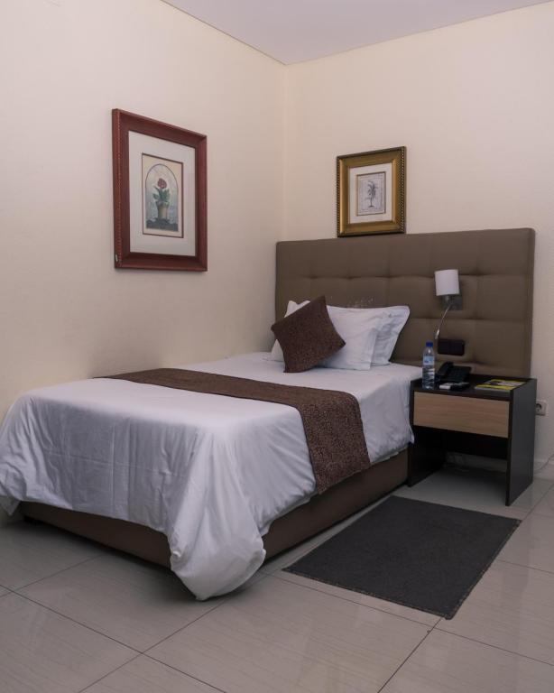 Postel nebo postele na pokoji v ubytování Hotel Monte Carlo