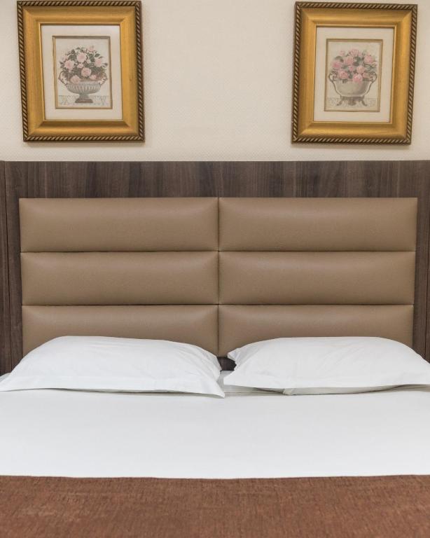 Postel nebo postele na pokoji v ubytování Hotel Monte Carlo