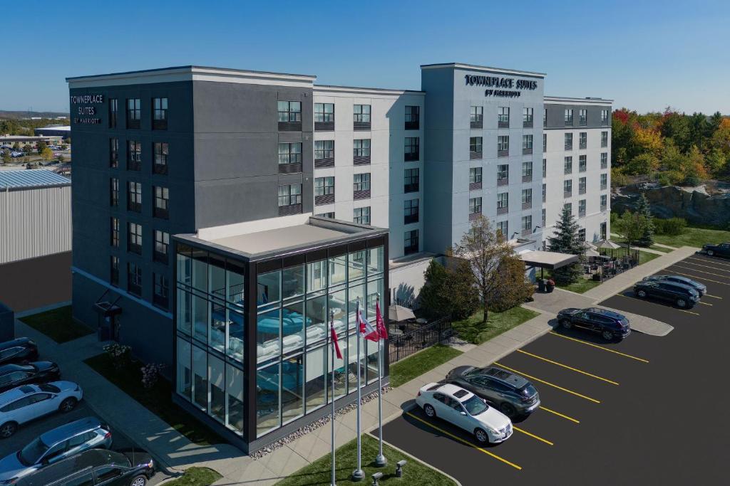 a rendering of a building with cars parked in a parking lot at TownePlace Suites by Marriott Sudbury in Sudbury