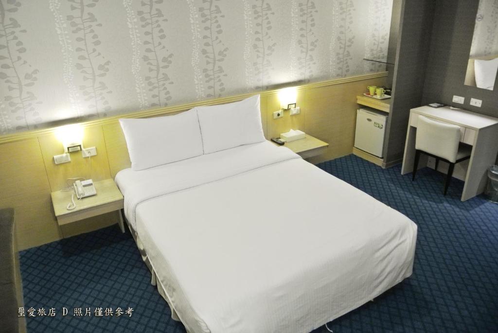 Postel nebo postele na pokoji v ubytování Say Love Hotel