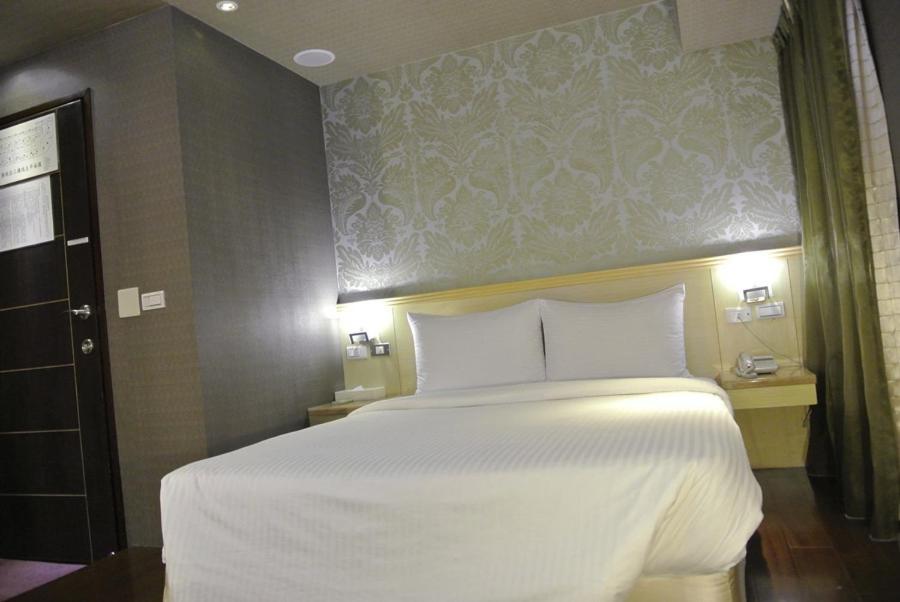 Postel nebo postele na pokoji v ubytování Say Love Hotel