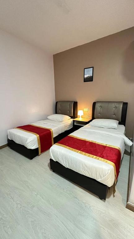 Postel nebo postele na pokoji v ubytování Hotel Ching Hua