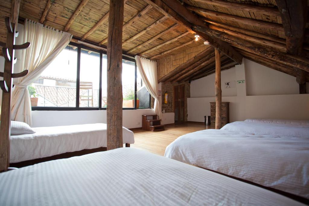 Postel nebo postele na pokoji v ubytování Arche Noah Boutique Hostel