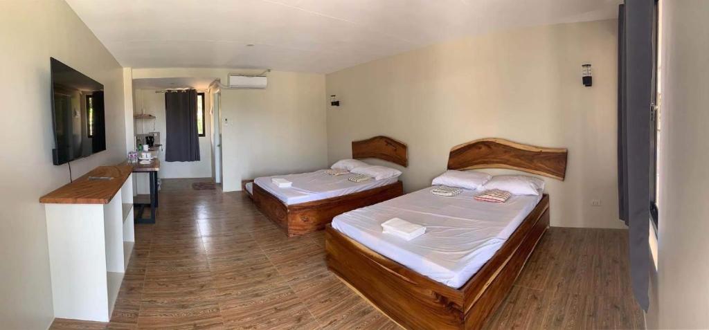 Postel nebo postele na pokoji v ubytování Lone Star Inn