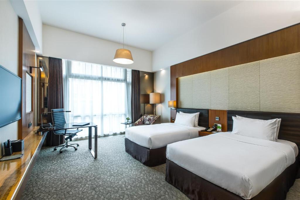 Postel nebo postele na pokoji v ubytování Vanburgh Hotel - Free shuttle bus transfer during Canton Fair