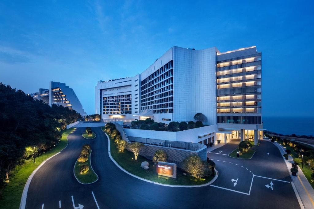 a large building with a road in front of it at Ananti at Busan Cove in Busan