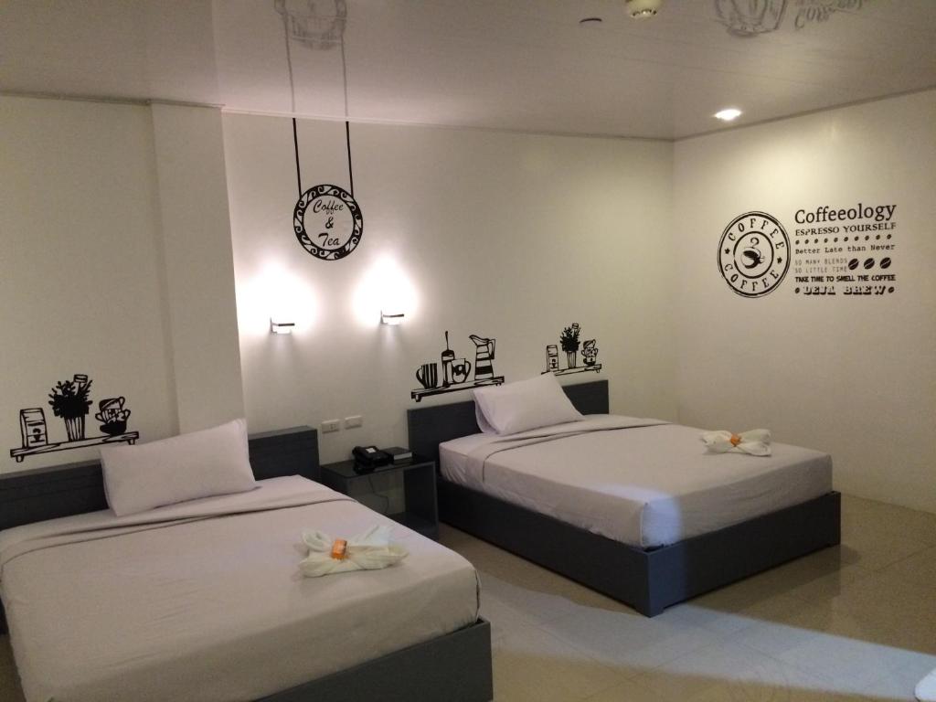 Postel nebo postele na pokoji v ubytování GC Suites