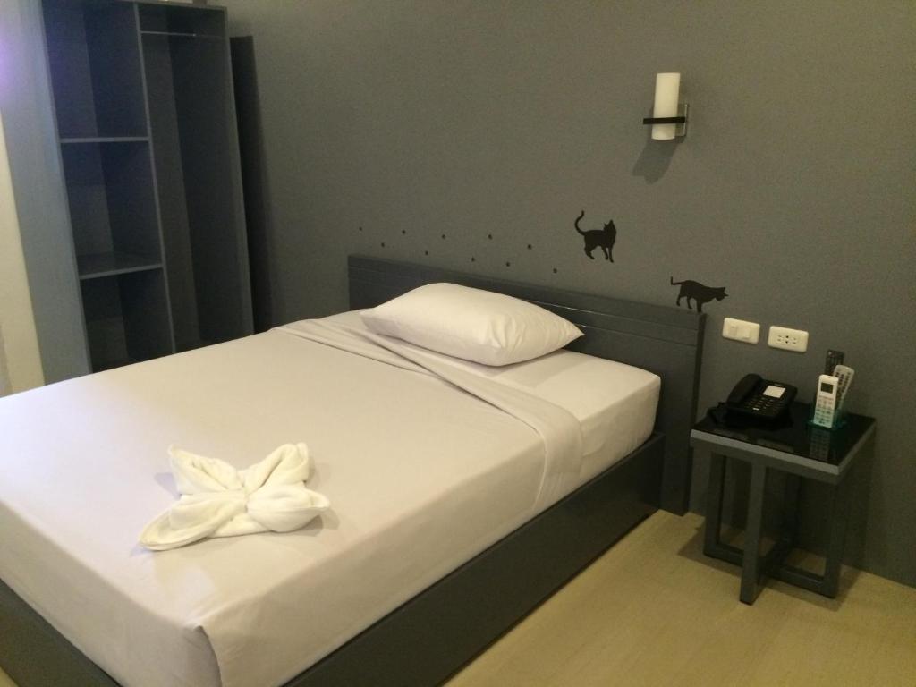 Postel nebo postele na pokoji v ubytování GC Suites