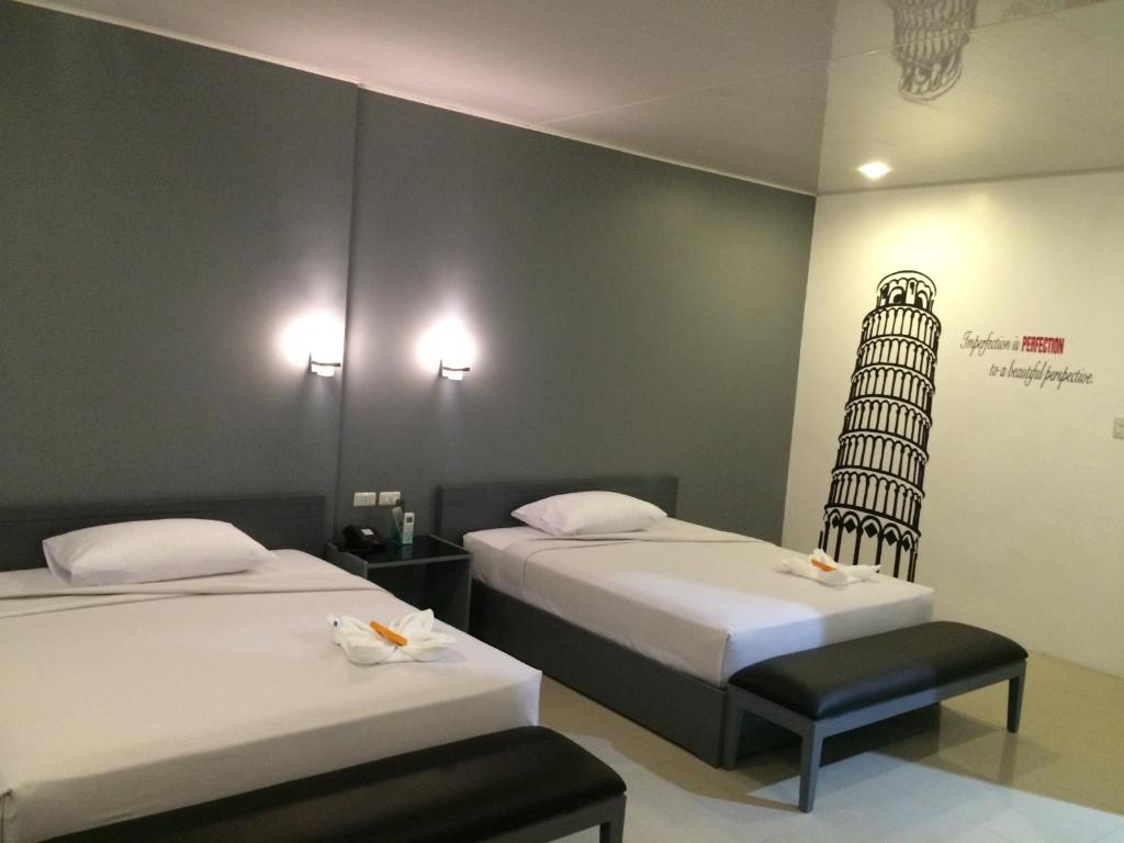 Postel nebo postele na pokoji v ubytování GC Suites