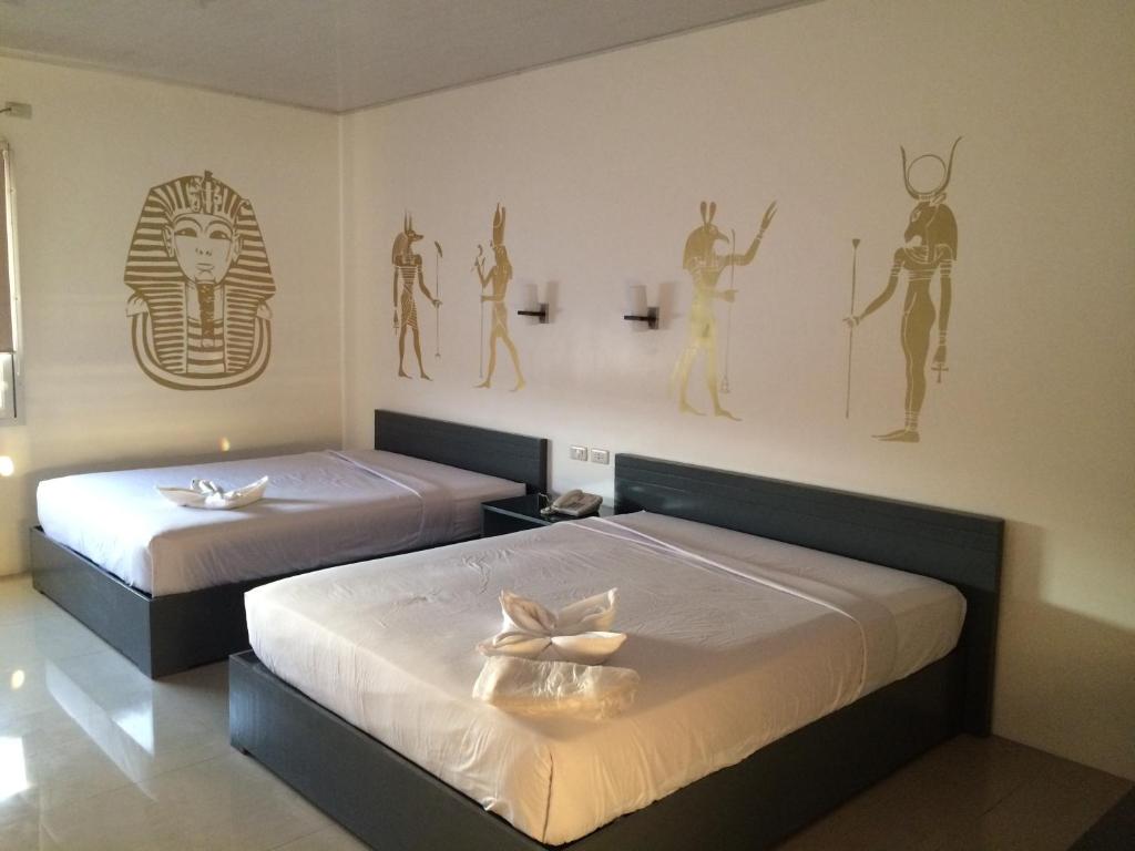 Postel nebo postele na pokoji v ubytování GC Suites