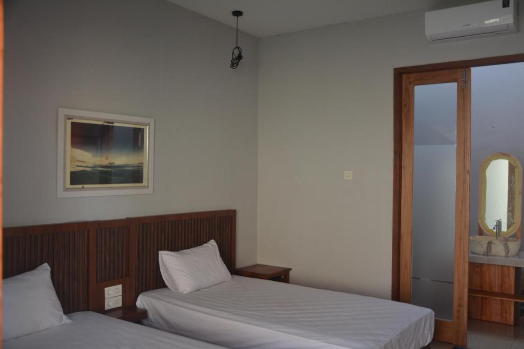 Postel nebo postele na pokoji v ubytování THe Kind Homestay