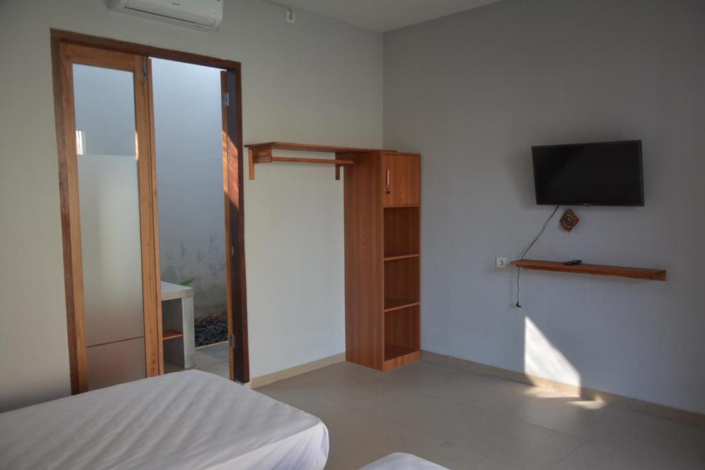 TV a/nebo společenská místnost v ubytování THe Kind Homestay