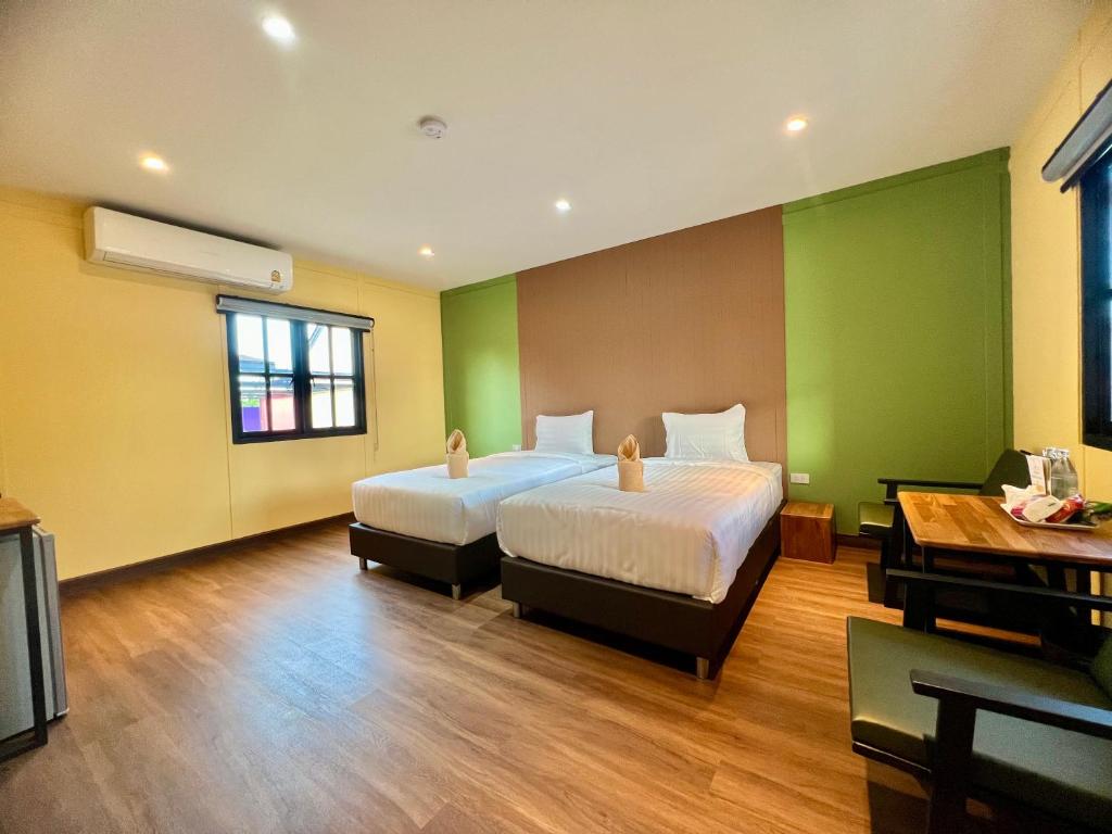 Postel nebo postele na pokoji v ubytování Napdown Resort Trat นับดาว รีสอร์ท ตราด
