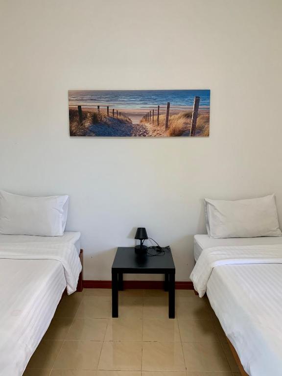Postel nebo postele na pokoji v ubytování ฝันดี รีสอร์ท-Fundee resort