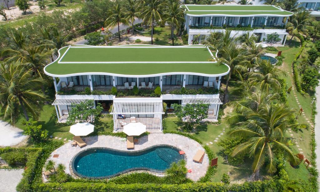 an aerial view of a resort with a swimming pool at Cam Ranh Riviera Beach Resort & Spa in Cam Ranh