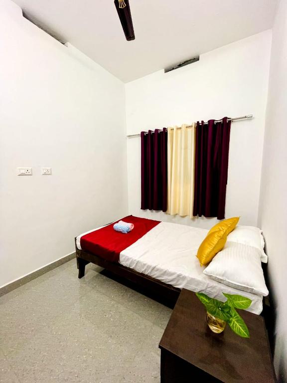 Postel nebo postele na pokoji v ubytování Evaa Homes