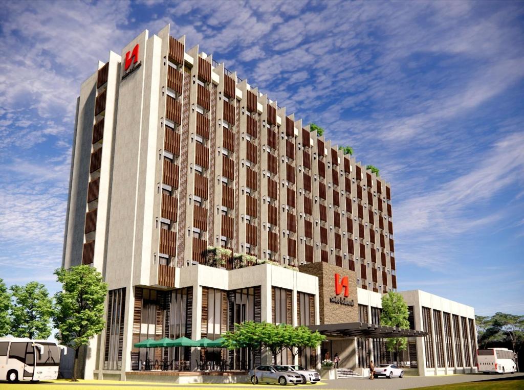 a rendering of a building with a hotel at Swiss-Belhotel Airport Yogyakarta in Temon