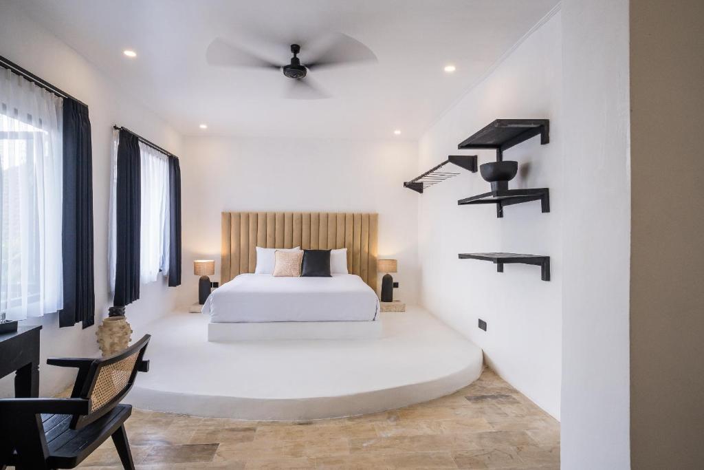 Postel nebo postele na pokoji v ubytování Casa Art Ubud