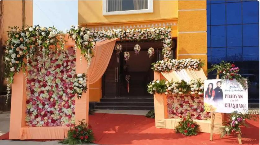 a front door of a house decorated with flowers at Hotel AS Lagoon in Bhubaneshwar