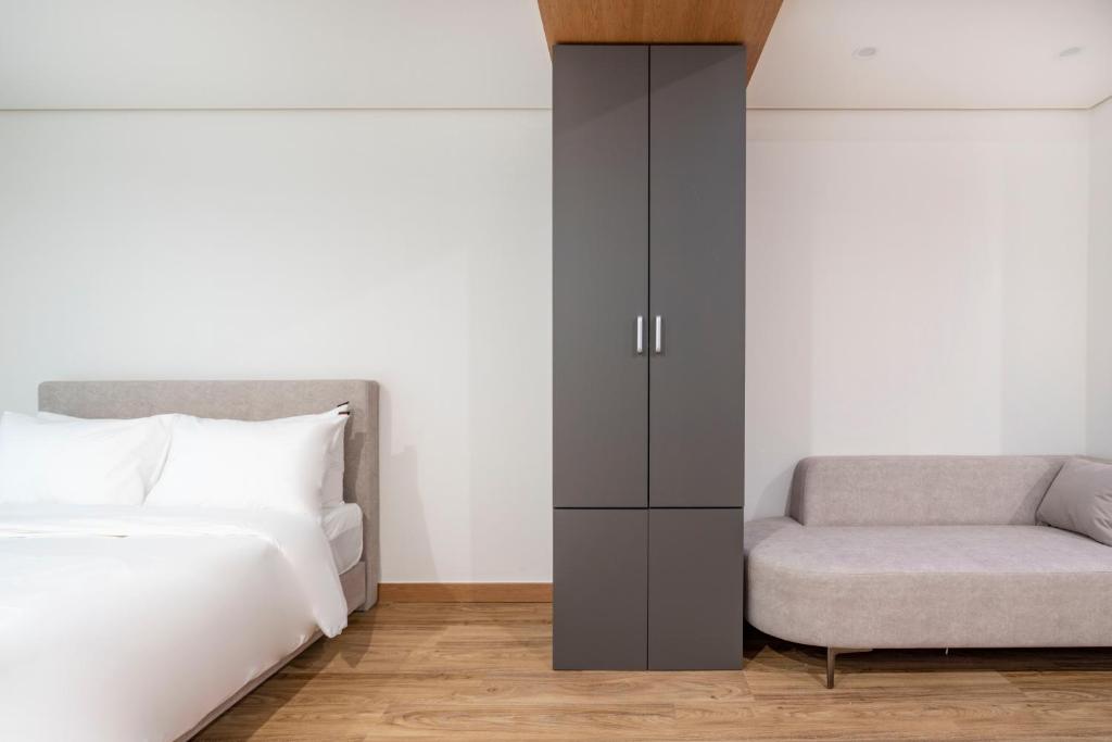 Postel nebo postele na pokoji v ubytování Centum Convention Hotel In Centum