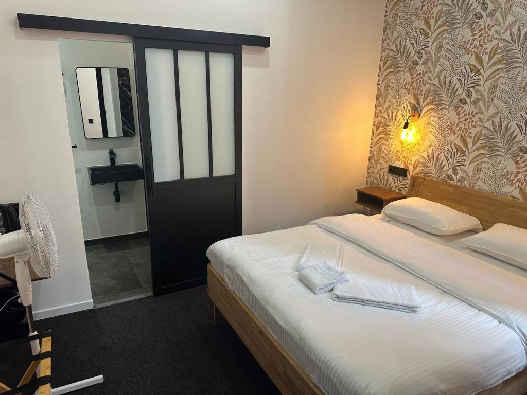 Postel nebo postele na pokoji v ubytování BED Collège