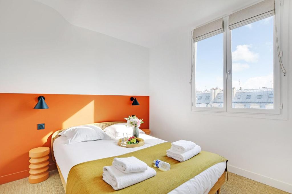 Postel nebo postele na pokoji v ubytování Amazing apartments in Châtelet - Rivoli