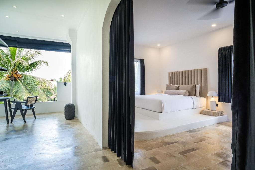 Postel nebo postele na pokoji v ubytování Casa Art Ubud