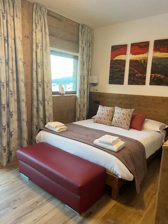 Postel nebo postele na pokoji v ubytování Edelweiss Hotel Champoluc