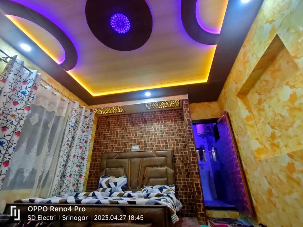 a room with a bed and a purple ceiling at Chapri homestay in Srinagar
