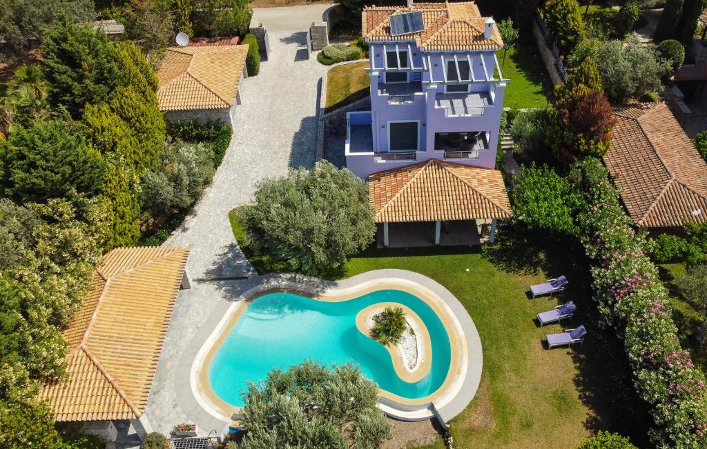 an aerial view of a house with a swimming pool at Villa Dalousa Retreat - Porto Heli in Porto Heli