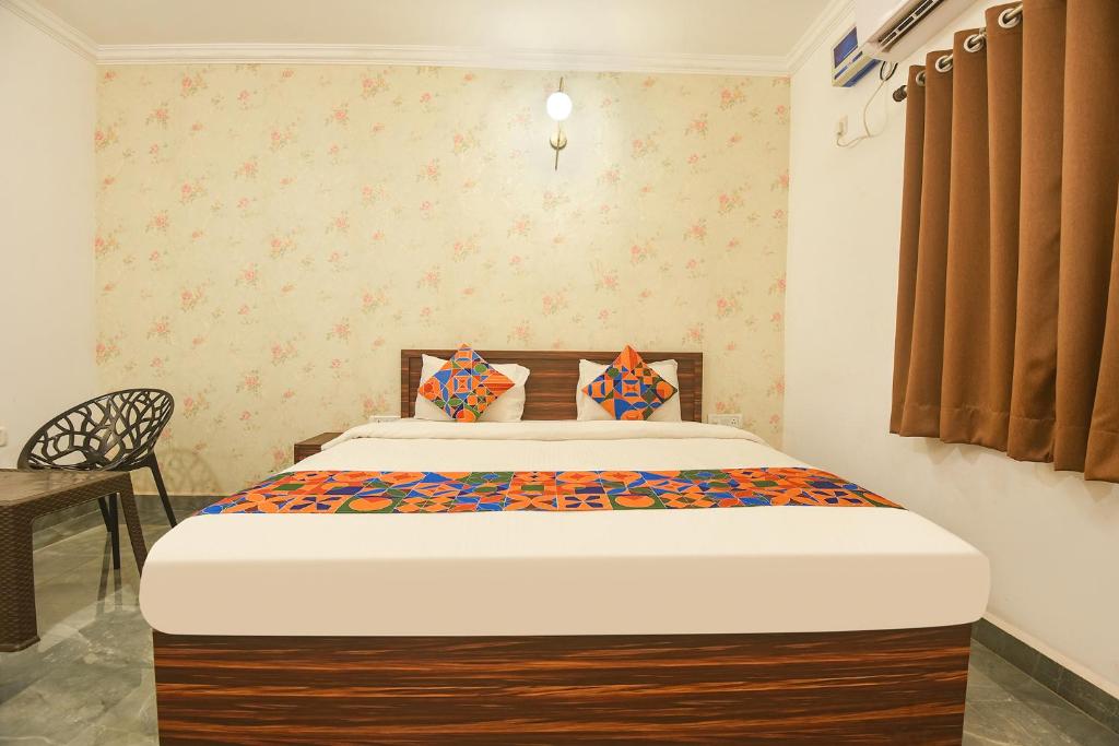 Postel nebo postele na pokoji v ubytování FabExpress MA Homes - Nr Morjim Beach
