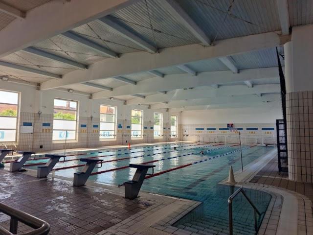 a large swimming pool with rows of lanes in it at Belliss in Osijek