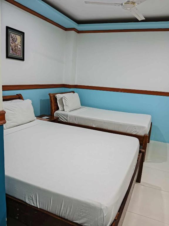 Postel nebo postele na pokoji v ubytování SG Hotel