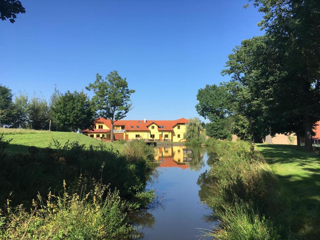 a house on the side of a river at Podveský mlýn in Tlumačov