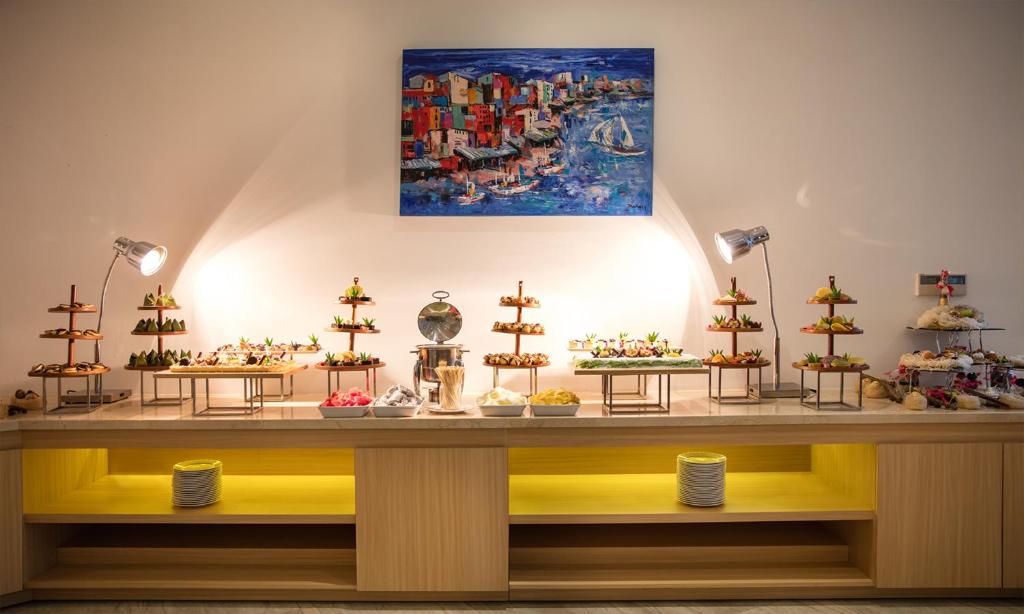 a table with miniature ships on it in a room at Cam Ranh Riviera Beach Resort & Spa in Cam Ranh