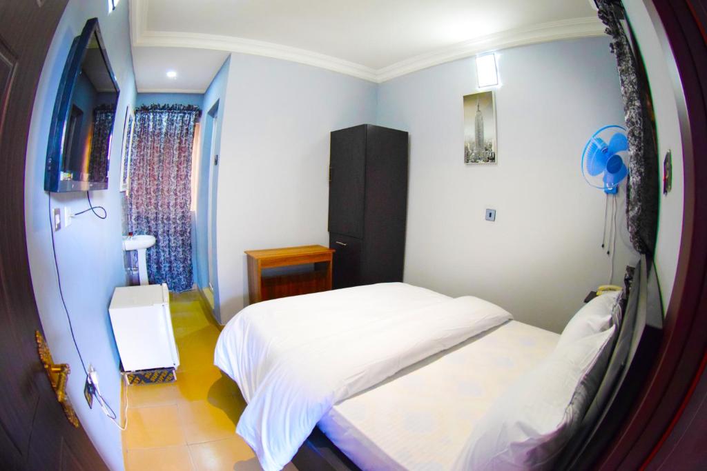 Postel nebo postele na pokoji v ubytování Remzy Hotel & Suites, Olomore