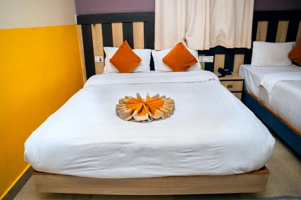 Postel nebo postele na pokoji v ubytování Hotel Kamana