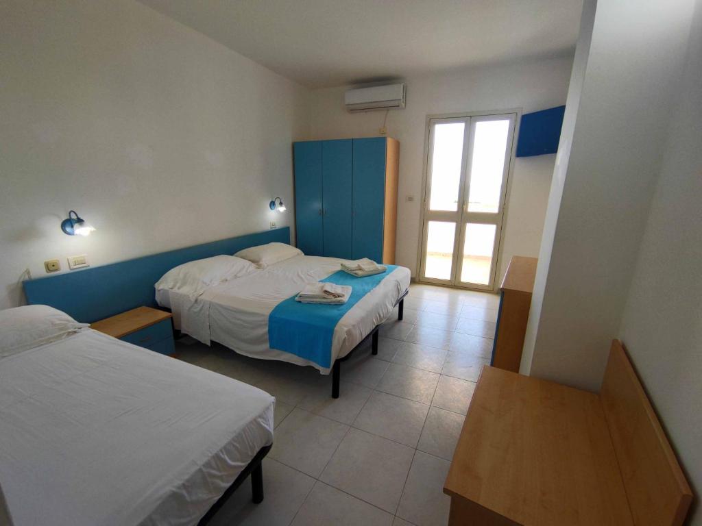 Postel nebo postele na pokoji v ubytování Picchio Hotel Pescoluse