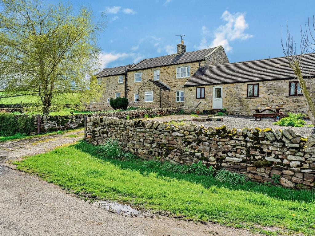 an old stone wall in front of a house at 2 Bed in Barnard Castle 90498 in Middleton in Teesdale