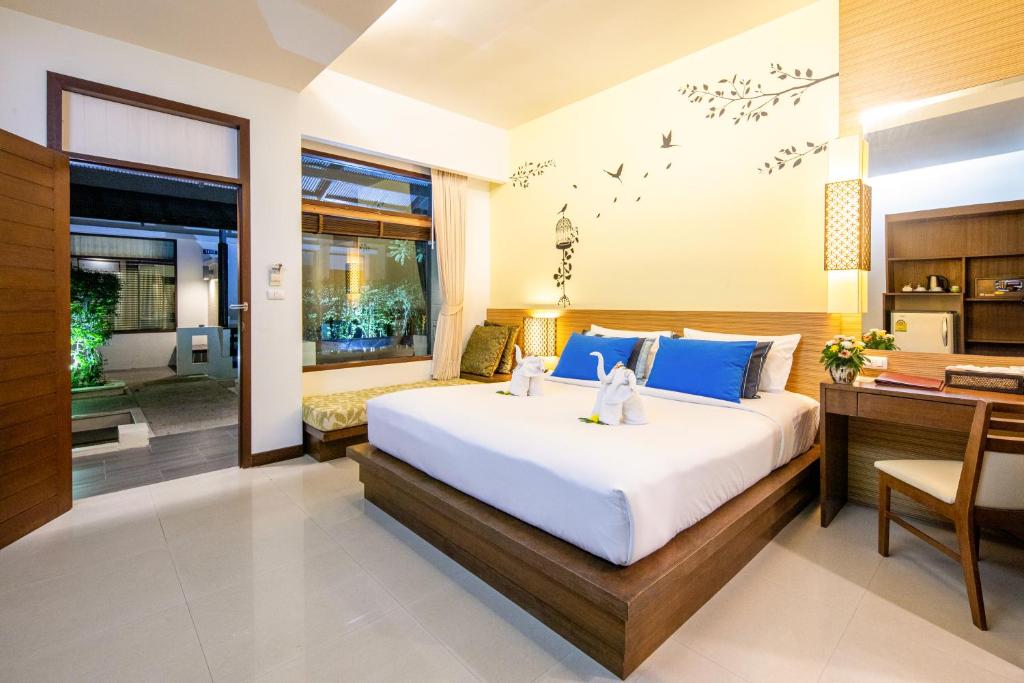 Postel nebo postele na pokoji v ubytování A2 Pool Resort - SHA Plus