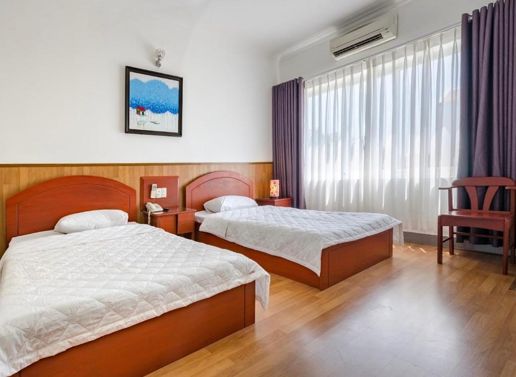 Een bed of bedden in een kamer bij Nam gia