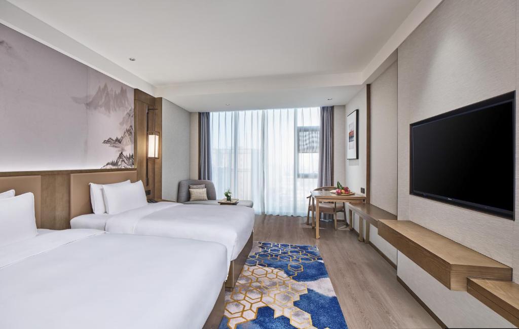 Crowne Plaza Chengdu Wuhou by IHGにあるベッド
