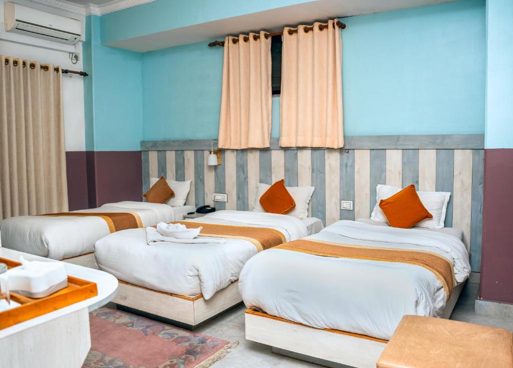 Postel nebo postele na pokoji v ubytování Hotel Kamana