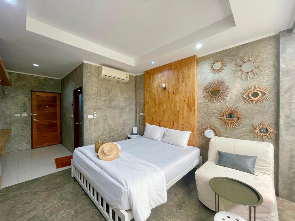 Postel nebo postele na pokoji v ubytování Check-in Resort Koh Larn