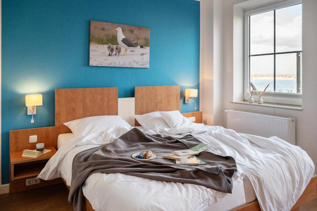 Postel nebo postele na pokoji v ubytování Hotel Alte Fischereischule