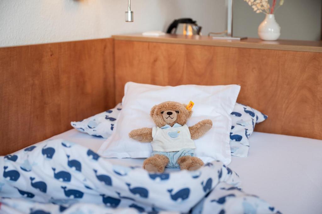 Postel nebo postele na pokoji v ubytování Hotel Alte Fischereischule