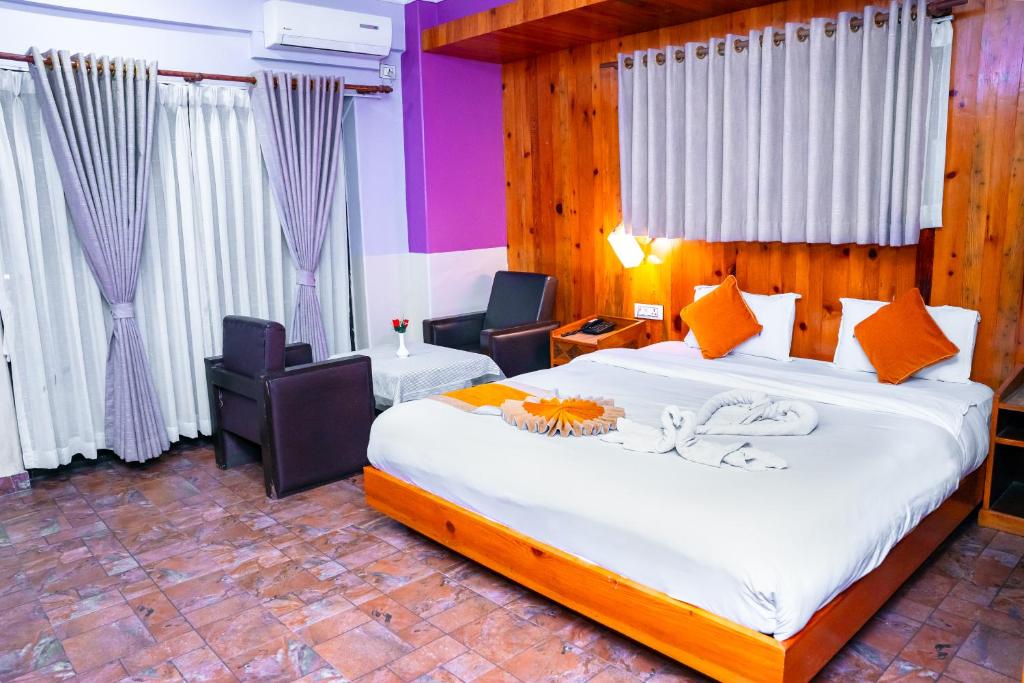 Postel nebo postele na pokoji v ubytování Hotel Kamana