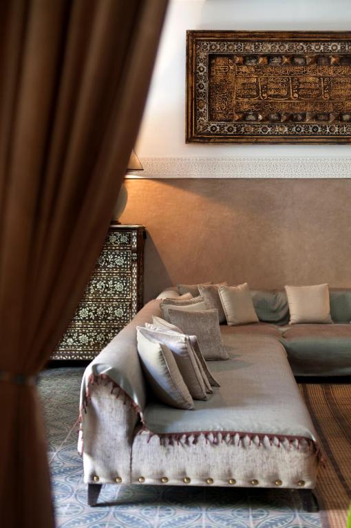 Postel nebo postele na pokoji v ubytování La Villa des Orangers - Relais & Châteaux