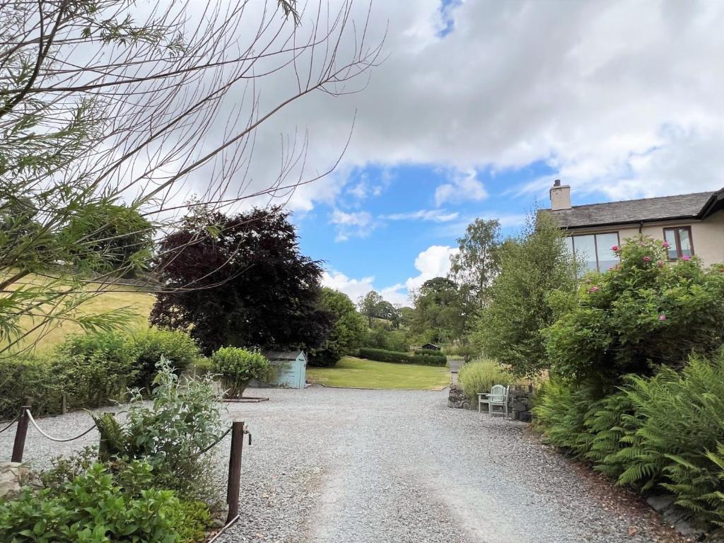 a gravel driveway in front of a house at 1 Bed in Ambleside 90636 in Ambleside